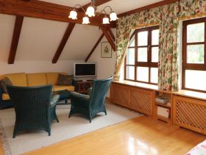 a living room with chairs and a couch at Holiday Home Aigen by Interhome in Radau