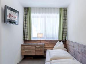 Tempat tidur dalam kamar di Apartment The PEAK-1 by Interhome