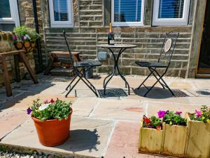 Patio nebo venkovní prostory v ubytování Ha'penny Cottage