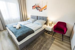 Posteľ alebo postele v izbe v ubytovaní Central Residence + 34 fotografií