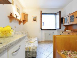 a kitchen with a bowl of bananas on a counter at Apartment Condominio al Parco-2 by Interhome in Canazei