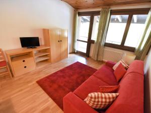 A television and/or entertainment centre at Apartment Frassan by Interhome