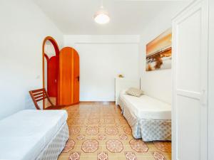 Posteľ alebo postele v izbe v ubytovaní Apartment Pinta by Interhome