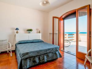 A bed or beds in a room at Apartment Nina by Interhome