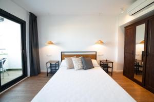 Apartaments Voralmar客房内的一张或多张床位