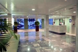 a lobby with potted plants in a building at Ona Marinas de Nerja Spa Resort in Nerja +37 photos
