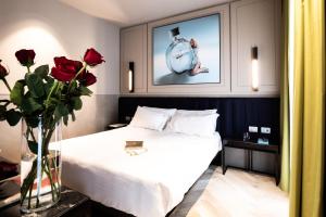 Postel nebo postele na pokoji v ubytování Heart Hotel Milano
