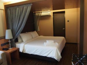 Postel nebo postele na pokoji v ubytování C'haya Hotel