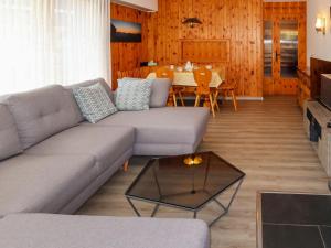a living room with a couch and a table at Apartment Platanes A1 by Interhome in Nendaz
