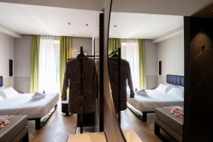Postel nebo postele na pokoji v ubytování Heart Hotel Milano