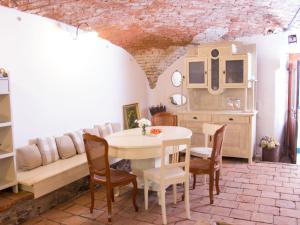 a living room with a table and chairs and a couch at Apartment Zábřeh-Lukavice 2 by Interhome in Zábřeh