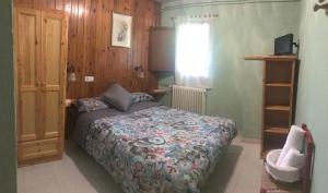 A bed or beds in a room at Casa Rural Cal Farragetes