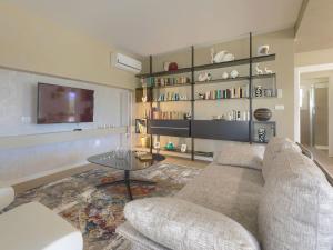 a living room with a couch and a table at Villa Laura by Interhome in Koromačno +43 photos