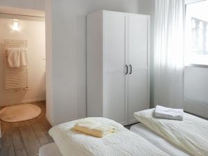 Postel nebo postele na pokoji v ubytování Apartment App- Vira Lago 500 Ost - EG by Interhome