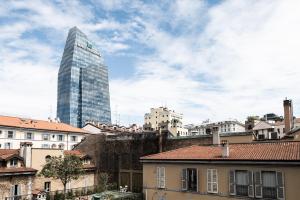 a city with a tall building in the background at Heart Hotel Milano in Milan