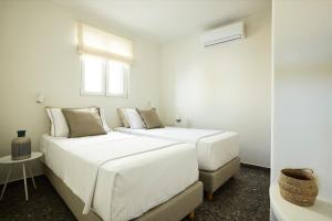Łóżko lub łóżka w pokoju w obiekcie Syllac Elegant Stay