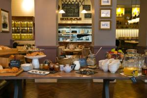 a table with food on it in a restaurant at Dog and Fox in London