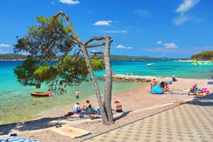 a group of people laying on a beach at Top View Biograd in Biograd na Moru