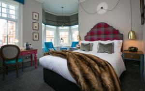 A bed or beds in a room at Dog and Fox 