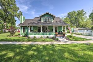 a home with a green house at Renovated Craftsman House with Patio and Fire Pit! in Vevay