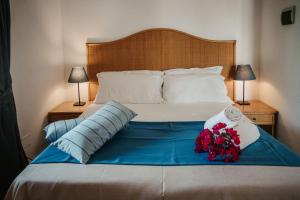 Posteľ alebo postele v izbe v ubytovaní Hotel Rojas