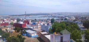 a view of a city with a river and buildings at APARTAMENTOS PALACIO RIAD LARACHE in Larache