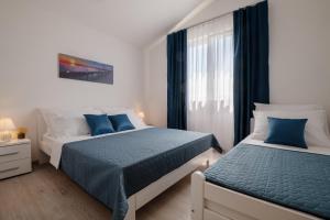Postel nebo postele na pokoji v ubytování Apartmani MATE Neum + 37 fotografií