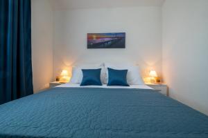 Postel nebo postele na pokoji v ubytování Apartmani MATE Neum