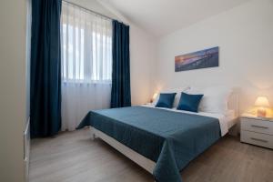 Postel nebo postele na pokoji v ubytování Apartmani MATE Neum