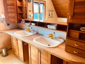 a bathroom with two sinks on a wooden counter at Gemütliche Fewo Nähe Hachenburg, Bad Marienberg in Langenbach bei Kirburg +11 photos