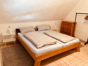 a bed with two pillows on it in a room at Gemütliche Fewo Nähe Hachenburg, Bad Marienberg in Langenbach bei Kirburg