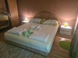 a bedroom with a bed with two pillows on it at Apartment Danijela in Senj +84 photos