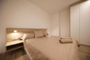 Postel nebo postele na pokoji v ubytování Apartmani Kiara + 33 fotografií