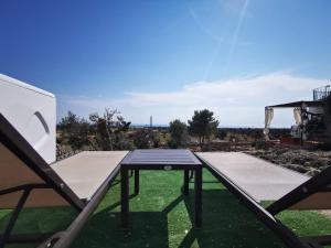 a ping pong table on the roof of a house at I Trulli di Emma by Apulia Home in Alliste