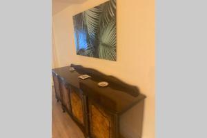 a fireplace in a room with a picture on the wall at SPA de charme 6 pers avec Jacuzzi & Sauna privatifs au coeur de ville - Esprit Coco in Mulhouse +32 photos