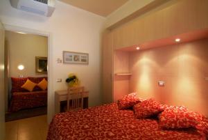 Postel nebo postele na pokoji v ubytování Hotel Mimosa