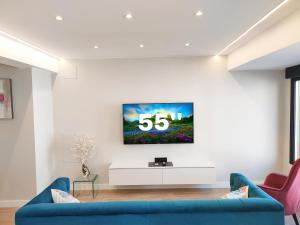 A television and/or entertainment centre at OVIEDO CENTRO SANTA CLARA PISO DE LUJO