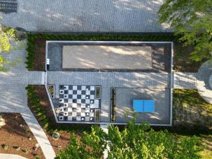 an overhead view of a pool with a checkered floor at Herrenhaus-Henriettenhof in Grömitz