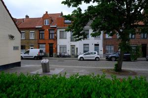 a group of cars parked in a parking lot at Bobs Bnb in Bruges