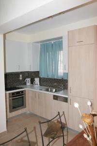 Kuchyňa alebo kuchynka v ubytovaní Erofili Villas