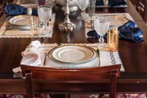 a table with plates and napkins on top of it at Private Nature Villa with Saltwater Pool in North Portugal in Cabeceiras de Basto +87 photos