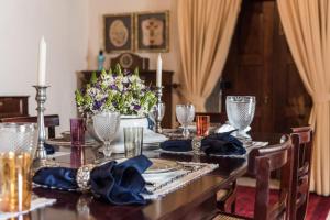 a dining room with a table with a blue table cloth at Private Nature Villa with Saltwater Pool in North Portugal in Cabeceiras de Basto