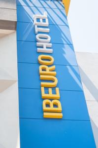 a blue and yellow sign for a store at Ibeurohotel Guadalajara Expo in Guadalajara