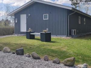 a building with a bench in front of it at 8 person holiday home in Fars in Ertebølle