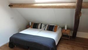 Кровать или кровати в номере Studio@Domburg