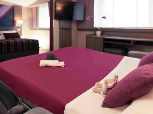 Postel nebo postele na pokoji v ubytování Mercure Beaune Centre