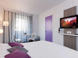 Кровать или кровати в номере ibis Styles Grenoble Centre Gare