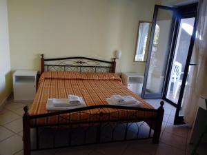 Tempat tidur dalam kamar di Olimpo