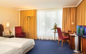 TV a/nebo společenská místnost v ubytování Hotel Glöcklhofer