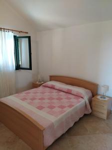 Posteľ alebo postele v izbe v ubytovaní Apartman A&M